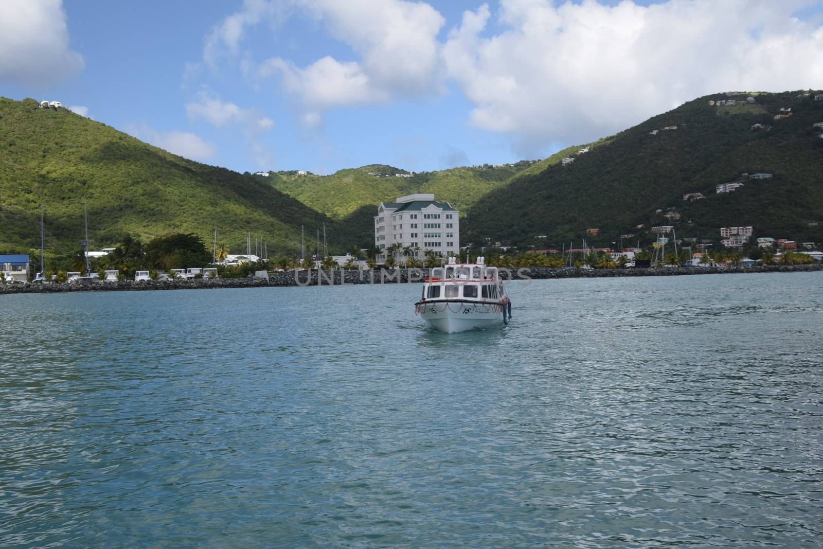 USA, Virgin Islands, Dec 2015: Water taxi make as transfer  in bay just off Tortula