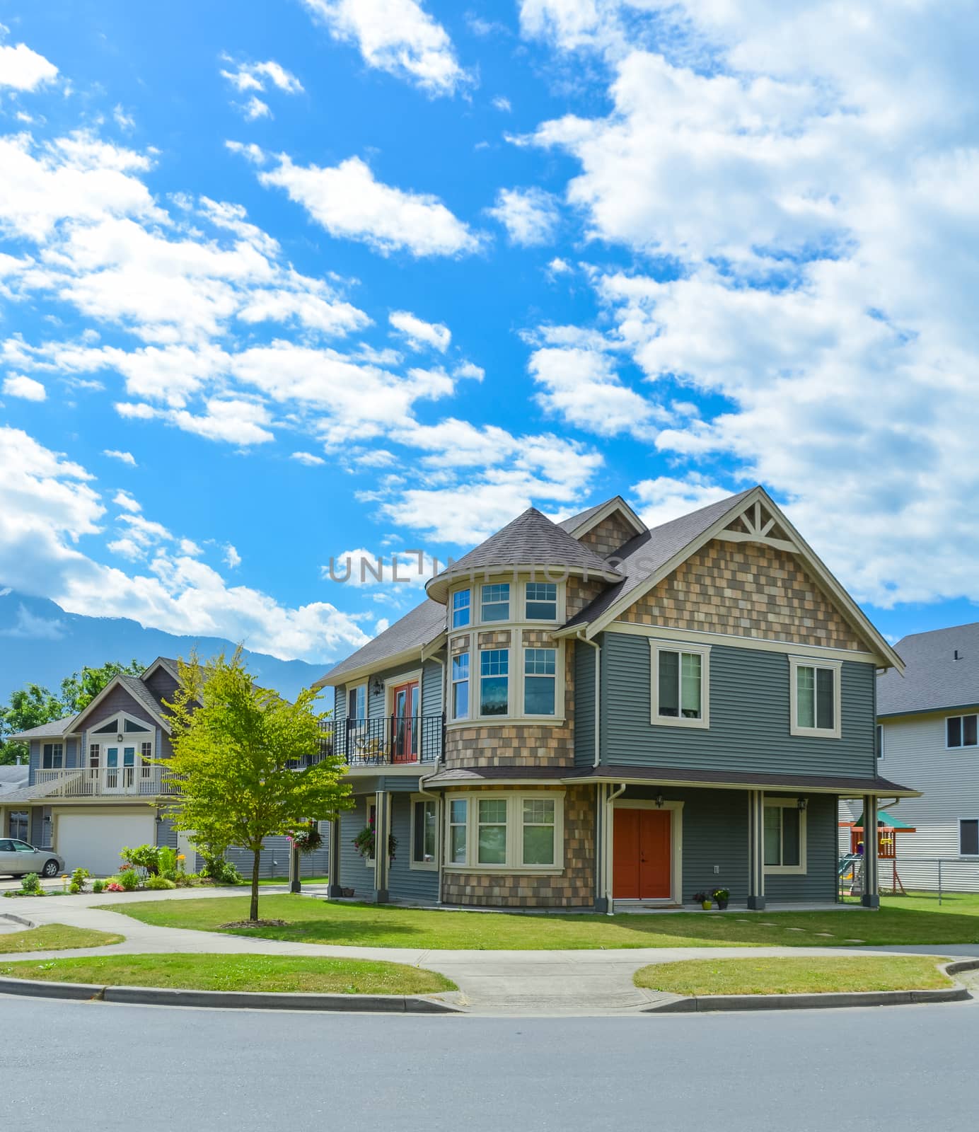 Luxury family house on cloudy, blue sky background in British Columbia, Canada