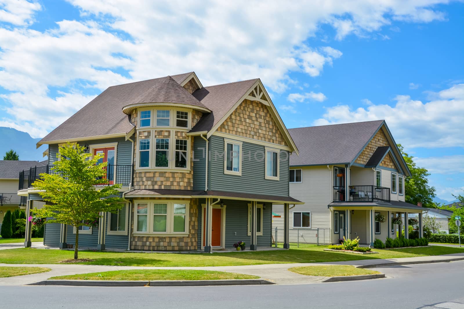 Luxury family house on cloudy, blue sky background in British Columbia, Canada