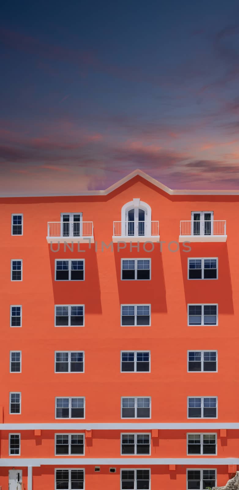 Orange Building on Dusk Sky by dbvirago