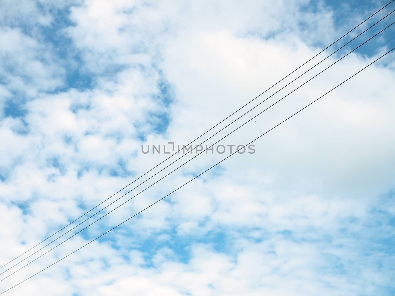 The high voltage cable on the background is an empty blue sky.
Minimal concept.