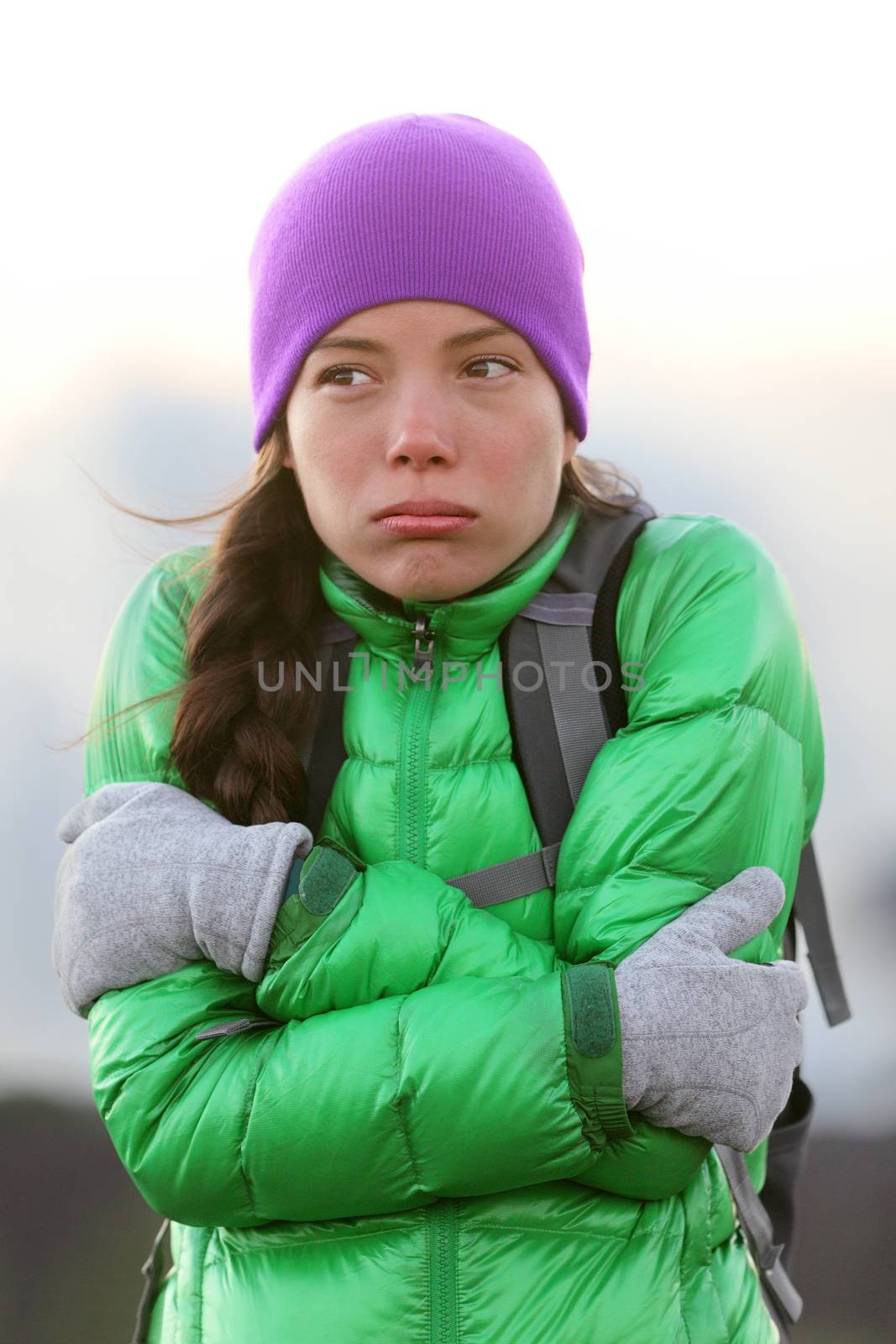 Freezing woman feeling cold outdoors by Maridav