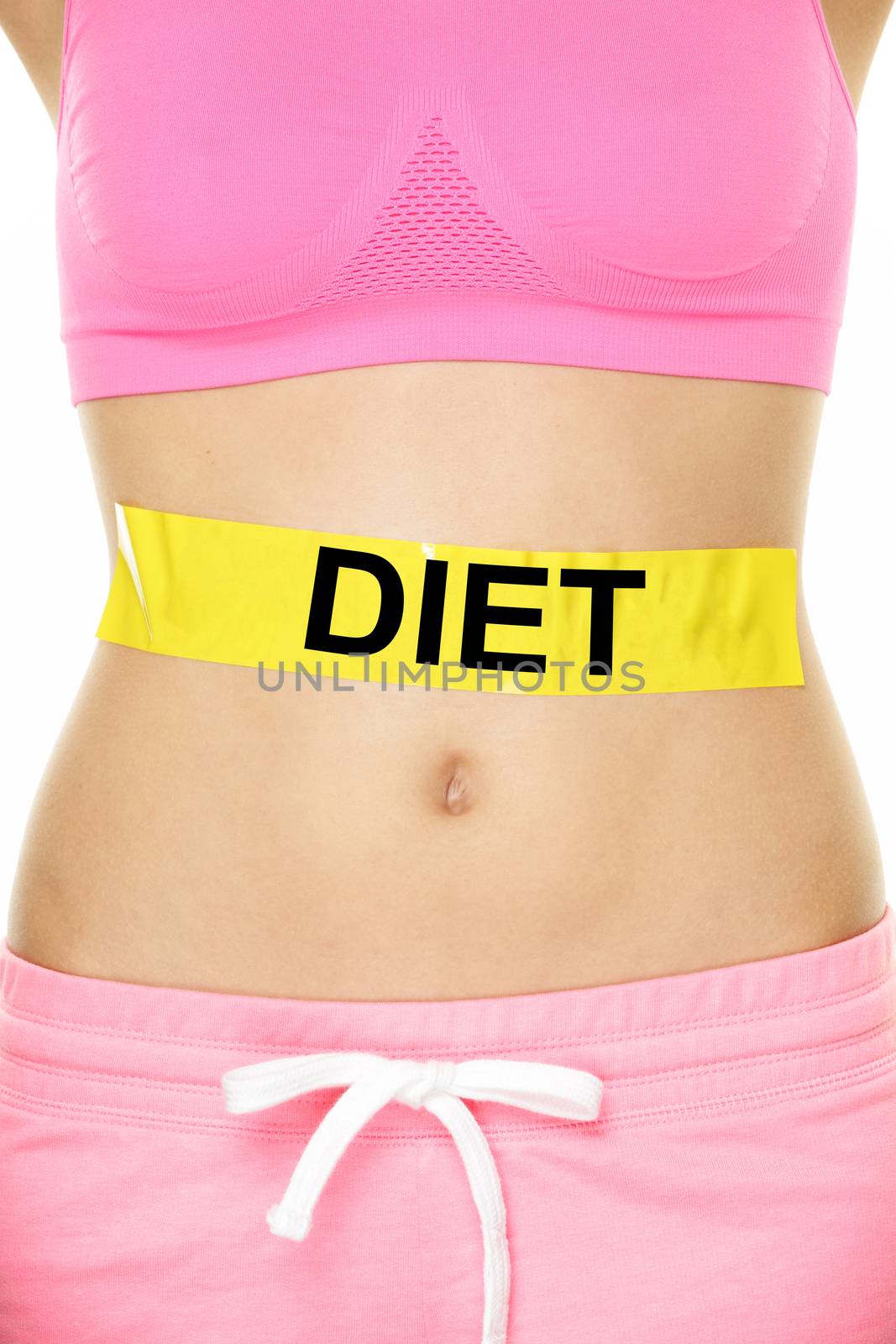 Diet and healthy eating concept - woman stomach showing DIET text written on female belly. Dieting concept showing slim fit female abdomen.