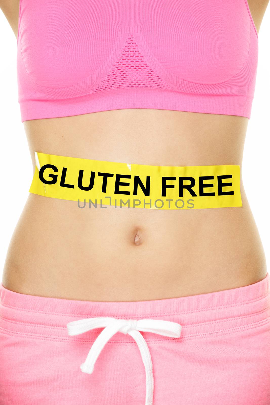 Gluten free health and Celiac disease and digestion concept with GLUTEN FREE text written on stomach abdomen sign on woman belly. Conceptual food allergies image.