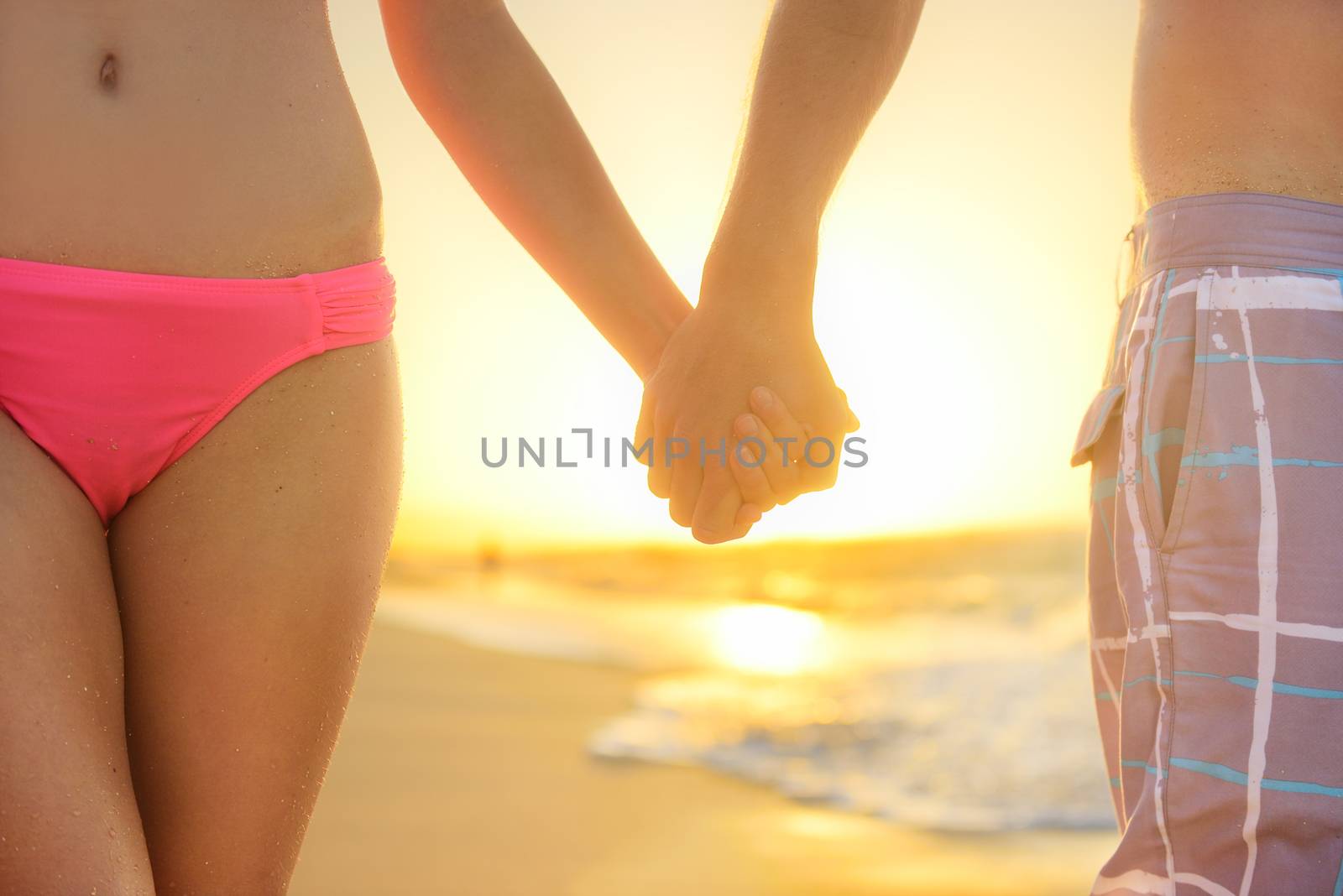 Love - romantic couple holding hands, beach sunset by Maridav