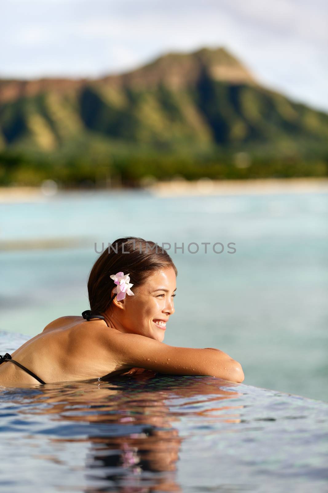 Travel vacations woman on holiday at beach resort by Maridav