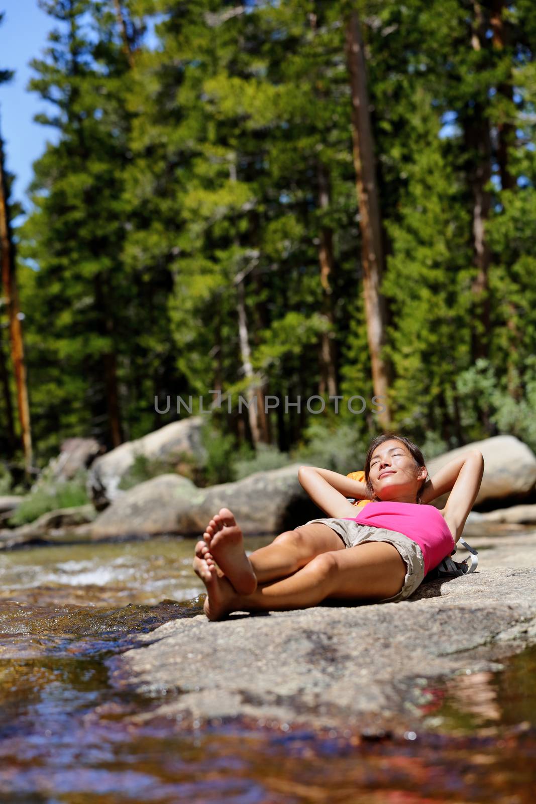 Hiking girl relaxing sleeping in nature forest by Maridav