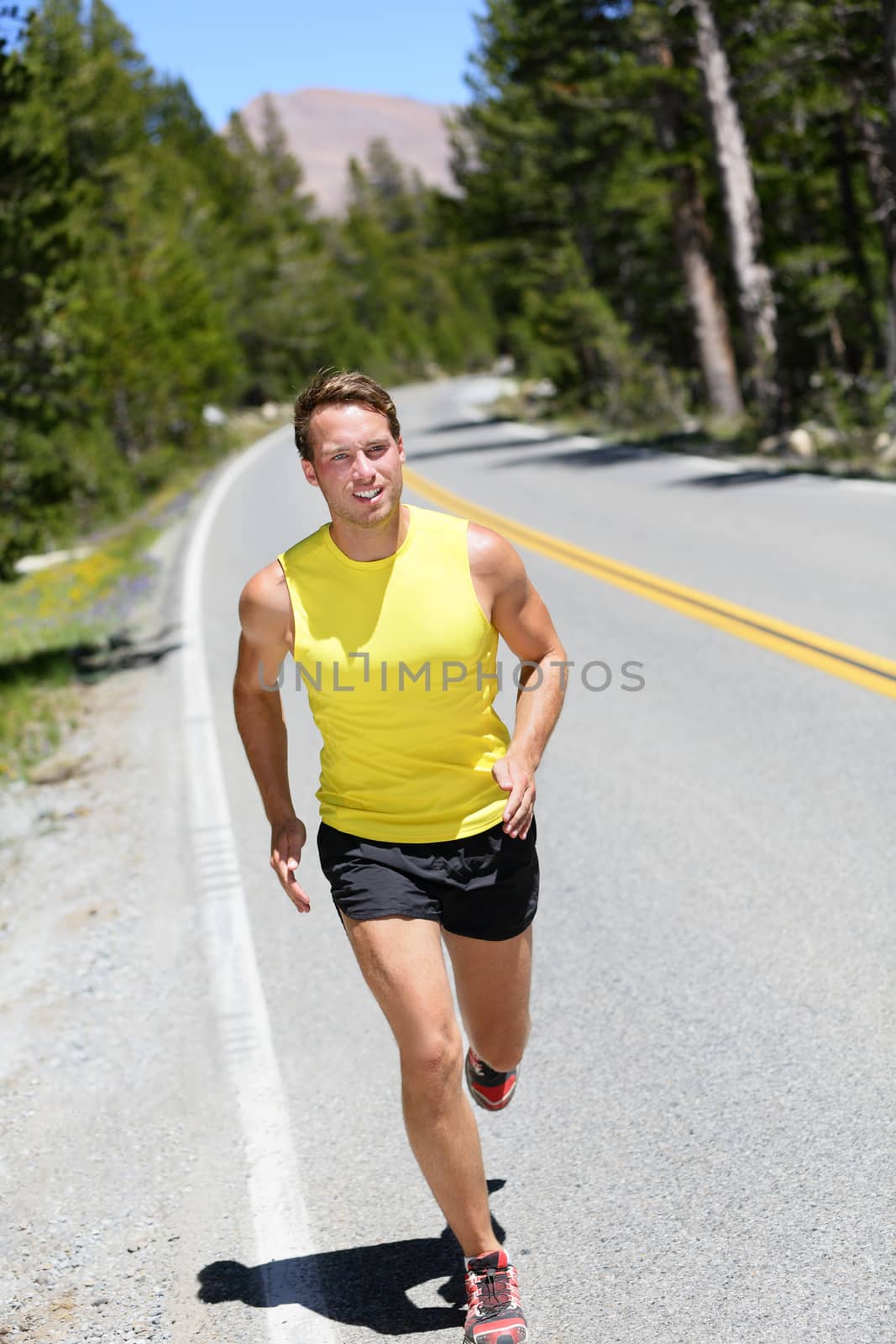 Running athlete man jogging on nature road by Maridav