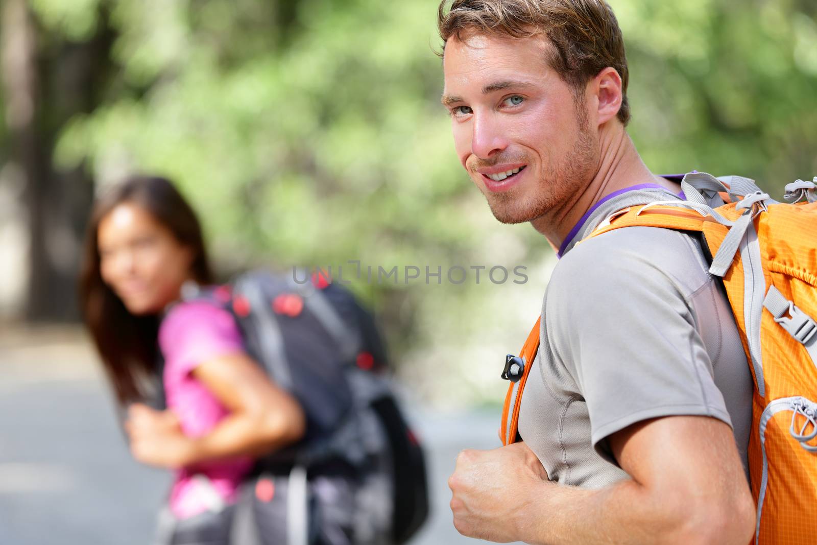 Hiking people - couple hikers happy in nature by Maridav