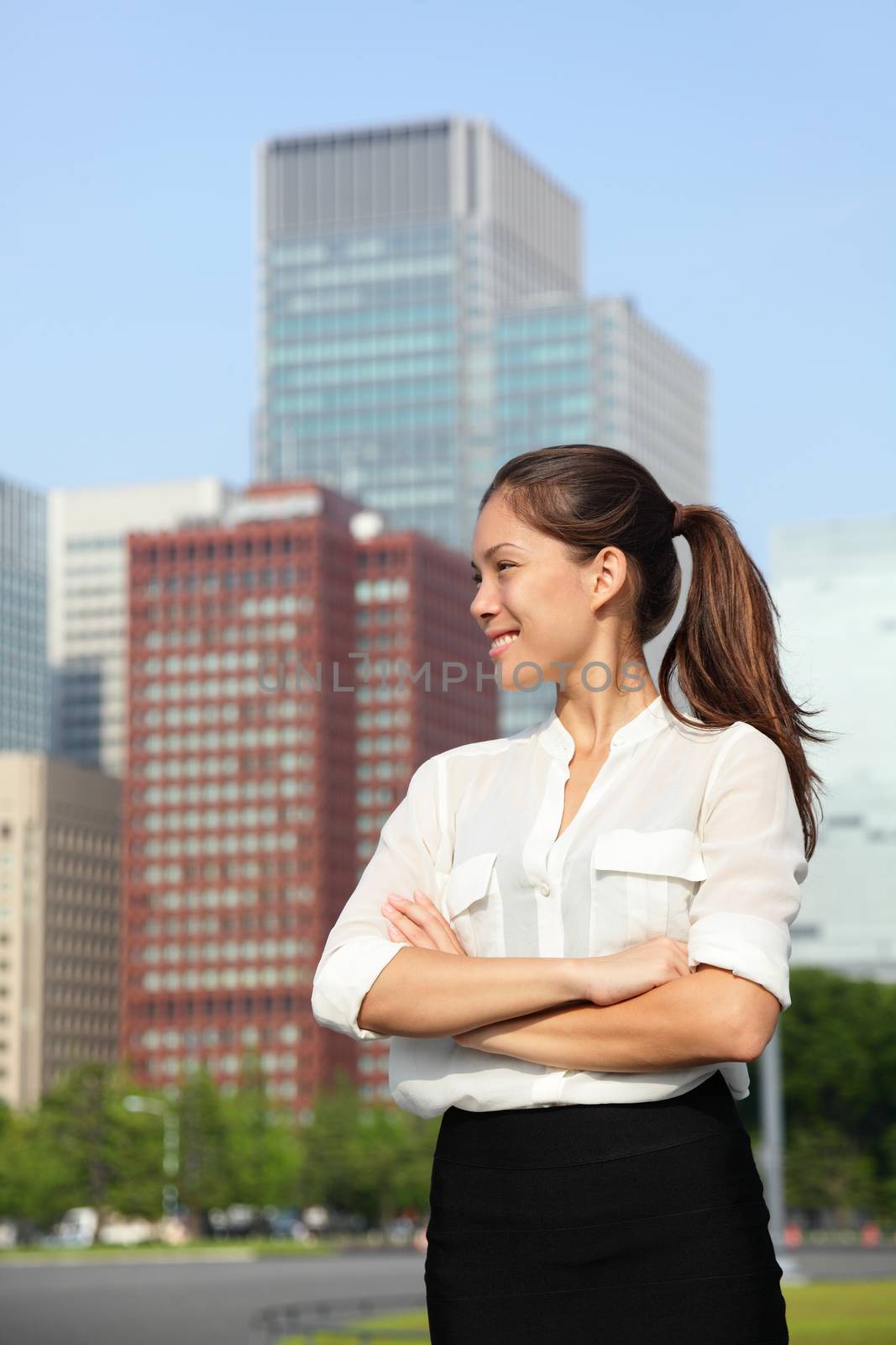 Asian businesswoman happy in urban Tokyo city by Maridav