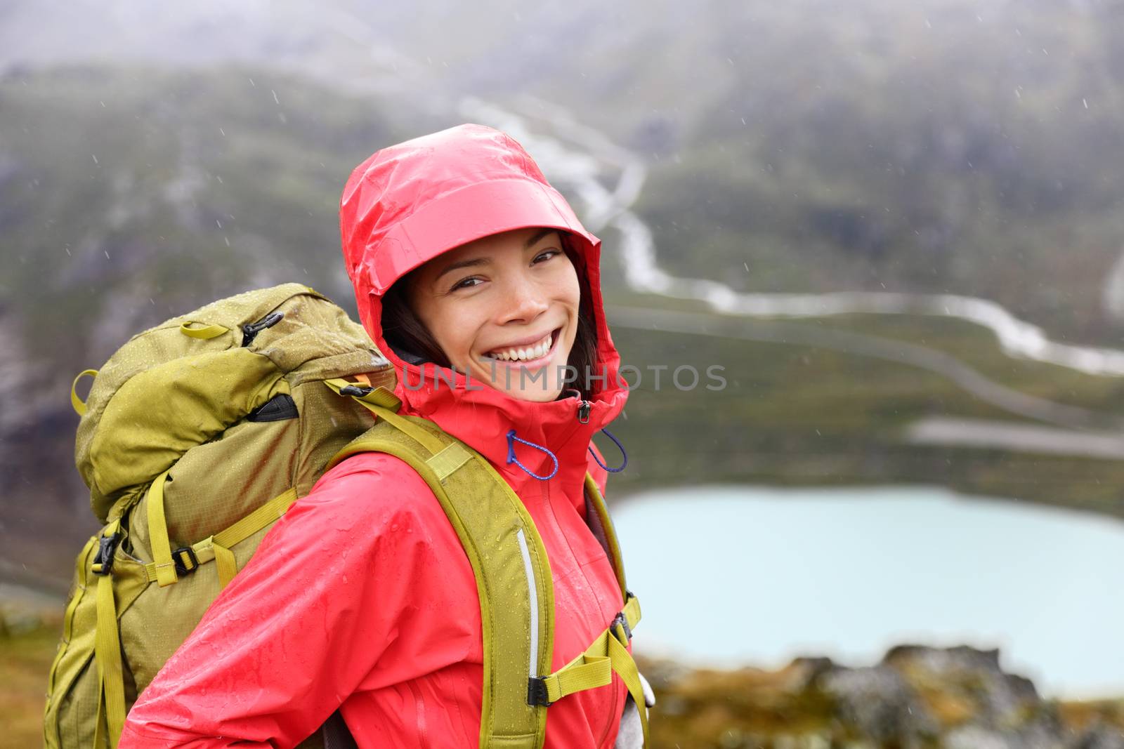 Happy young asian hiker woman hiking portrait by Maridav