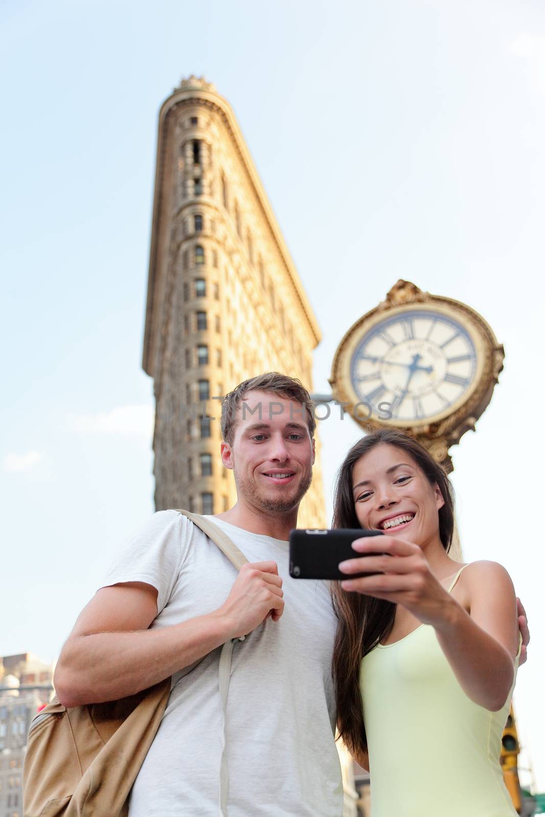 New York couple taking tourist selfie Flatiron NYC by Maridav