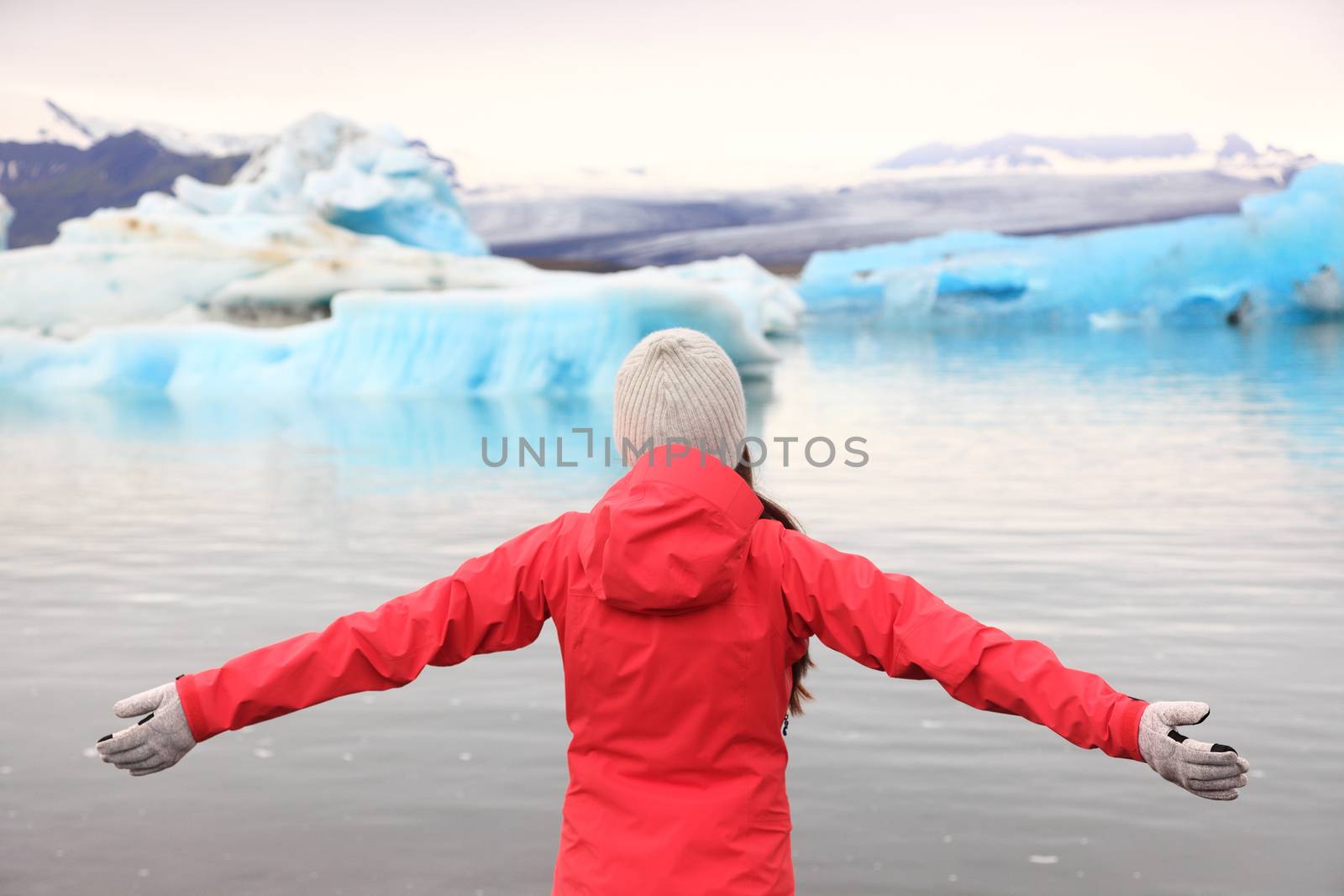 Freedom happy woman at glacier lagoon on Iceland by Maridav