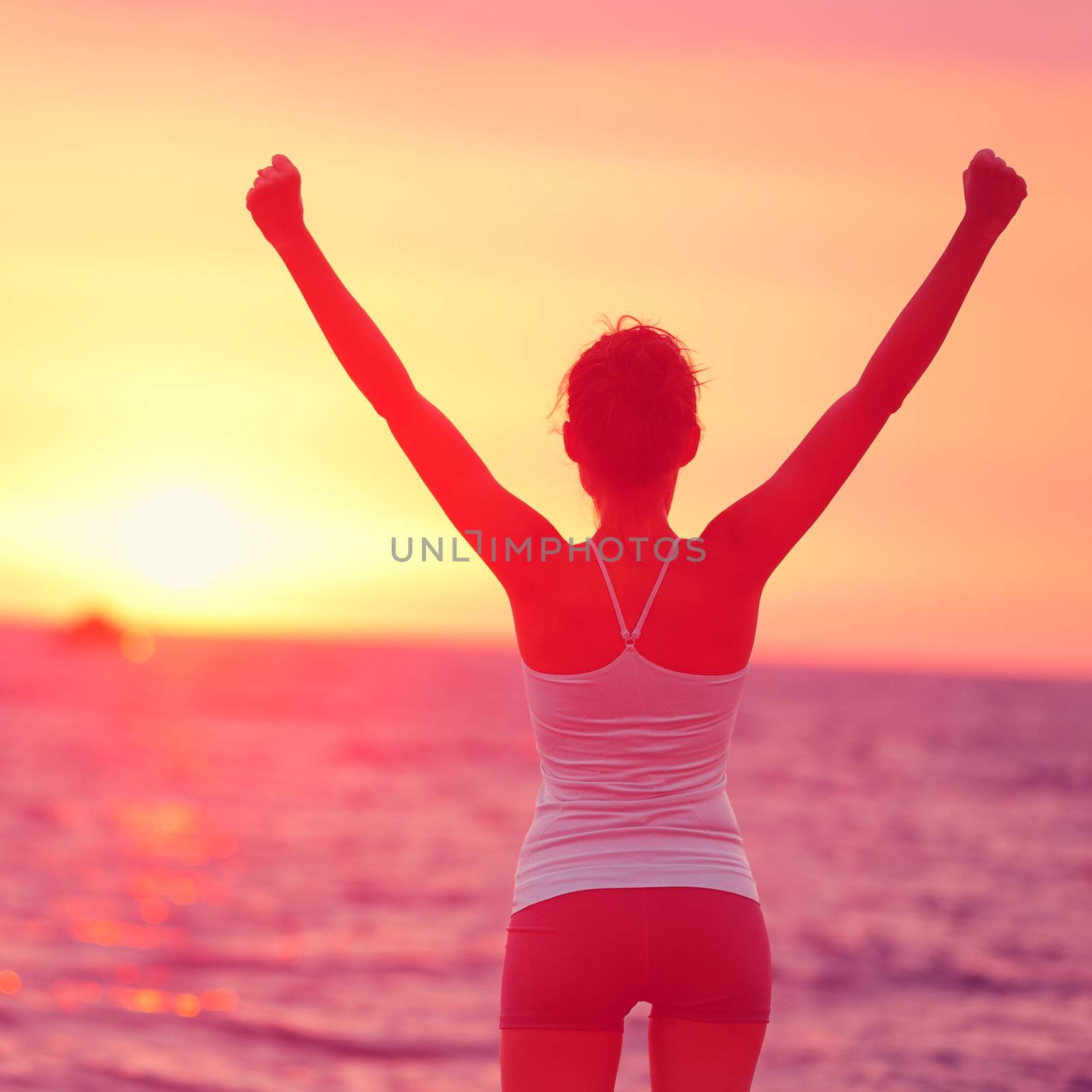 Life achievement - happy woman arms up in success by Maridav