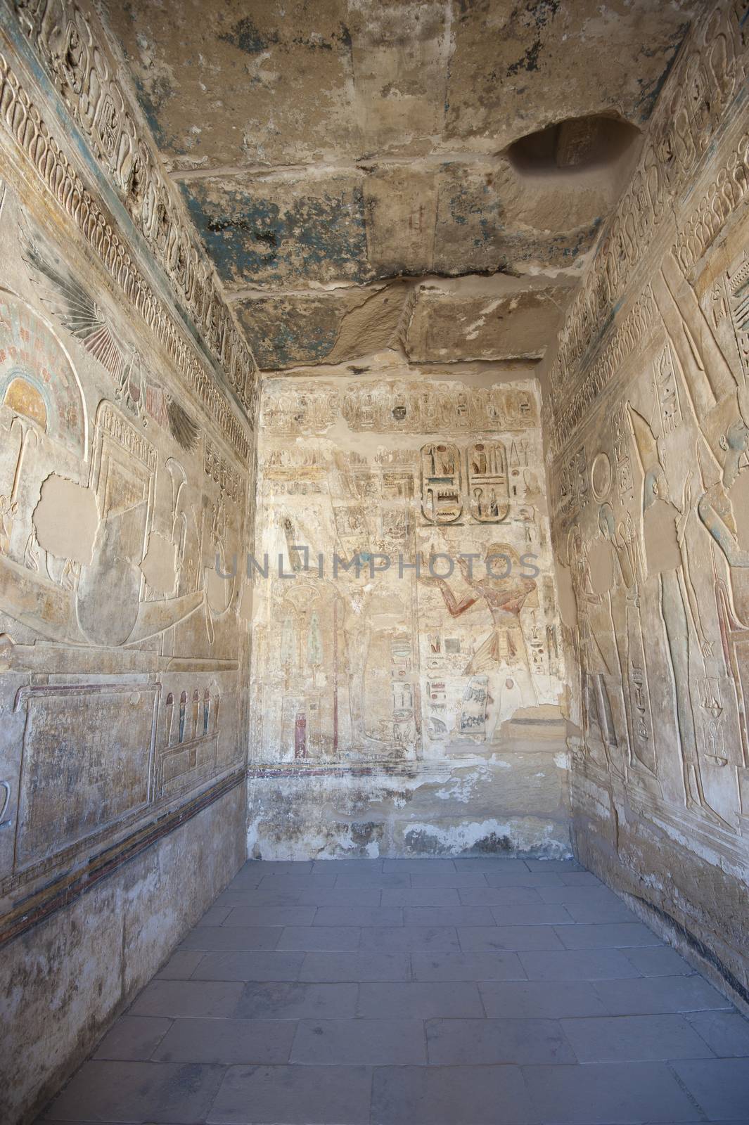 Egyptian hieroglyphic carvings and paintings on interior wall of the ancient temple at Medinat Habu in Luxor