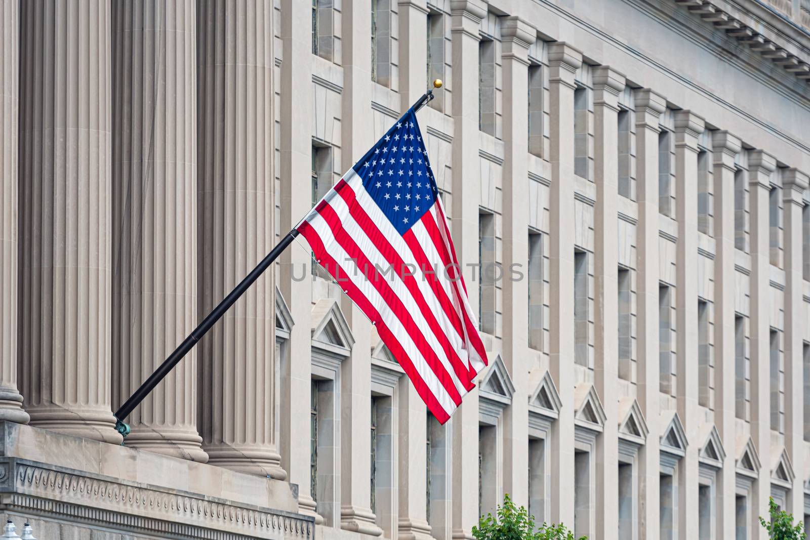 American flag on the facade of a historic building