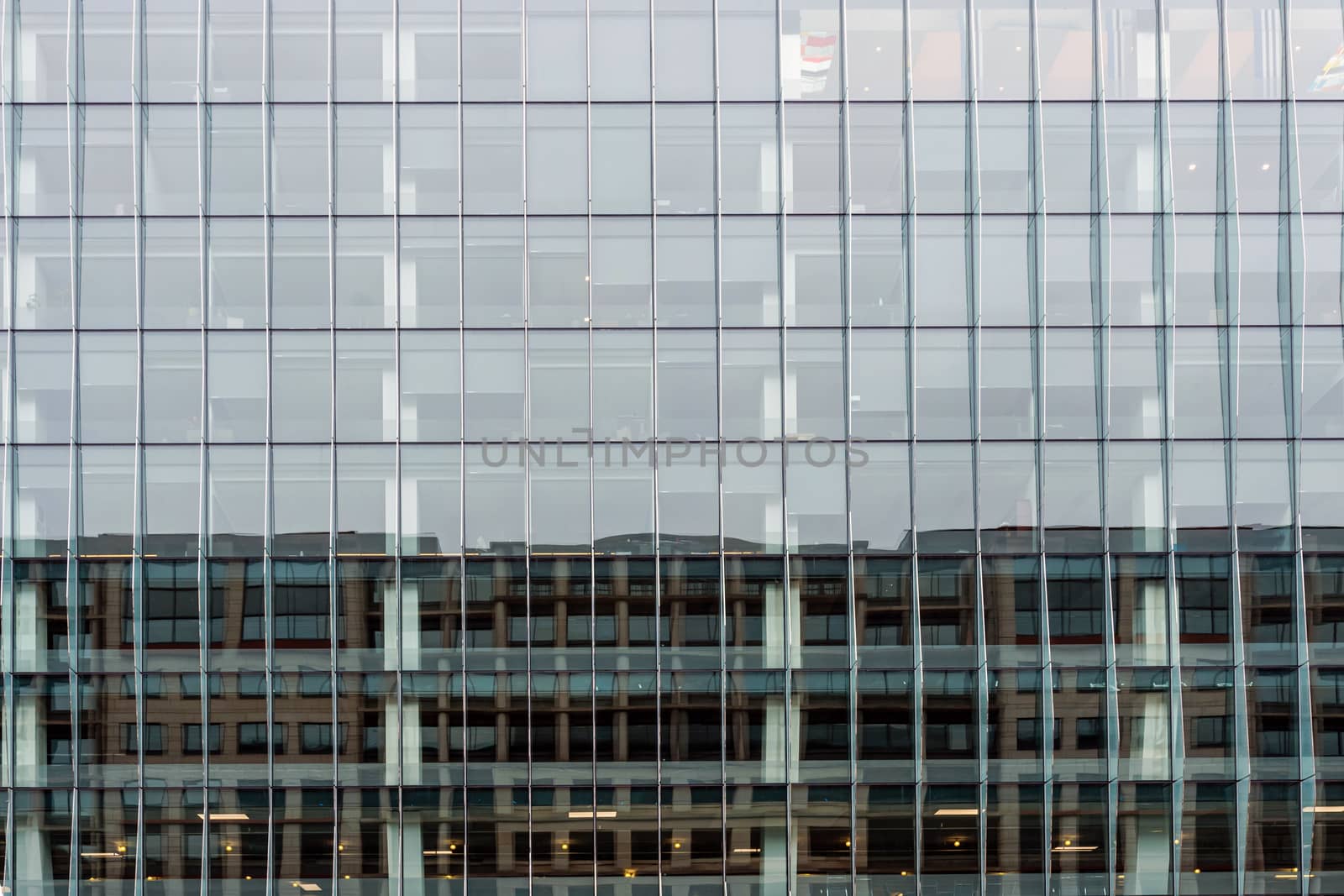 Glass office building facade with windows, texture, architecture