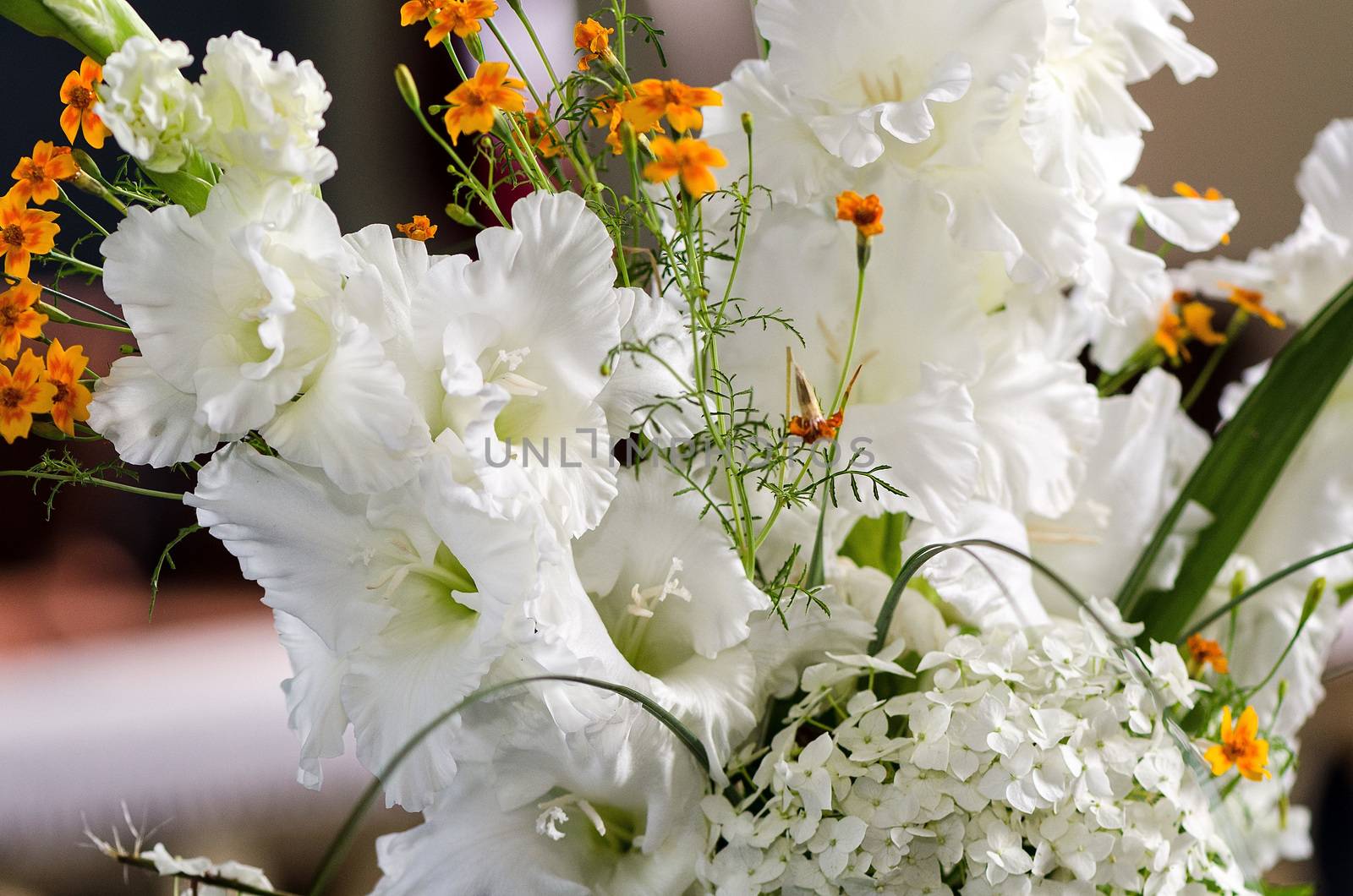 White and yellow flowers in the wedding floral decorations.