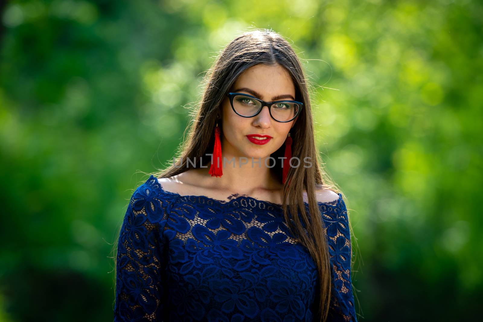 Portrait of young woman  at park. Shallow depth of field.