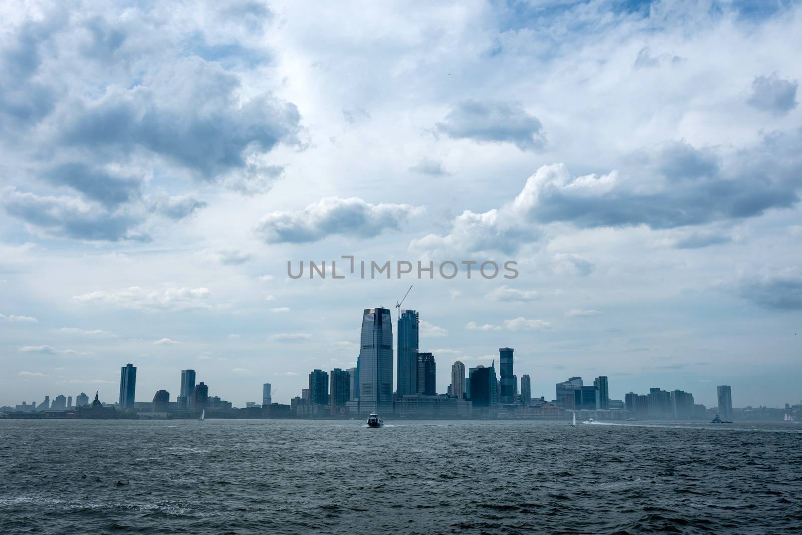 Skyline and modern office buildings of Midtown Manhattan viewed from across the Hudson River. - Image