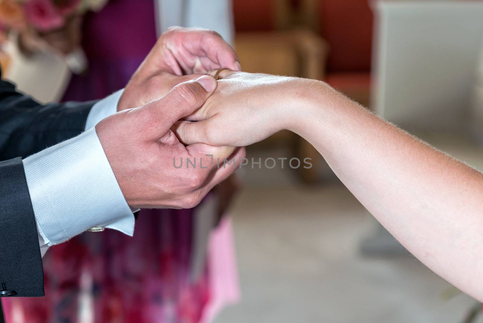 The groom and the bride exchange rings.