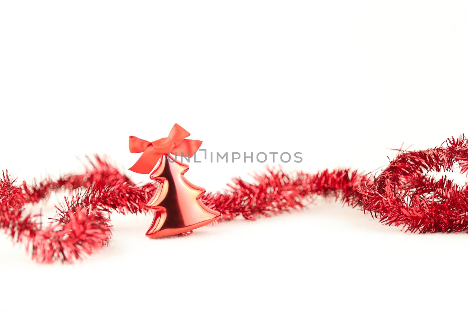 Isolated red Christmas tree bauble with red wreath and red flake on white background by robbyfontanesi