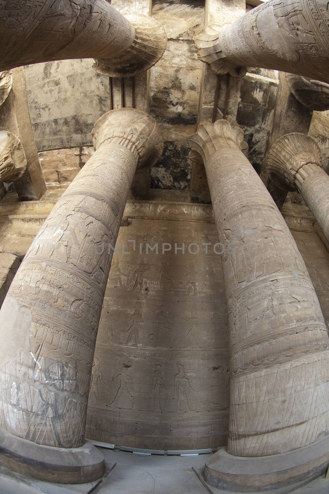 Fisheye view of columns in the main hall at Edfu Temple in Egypt with hieroglyphic carvings