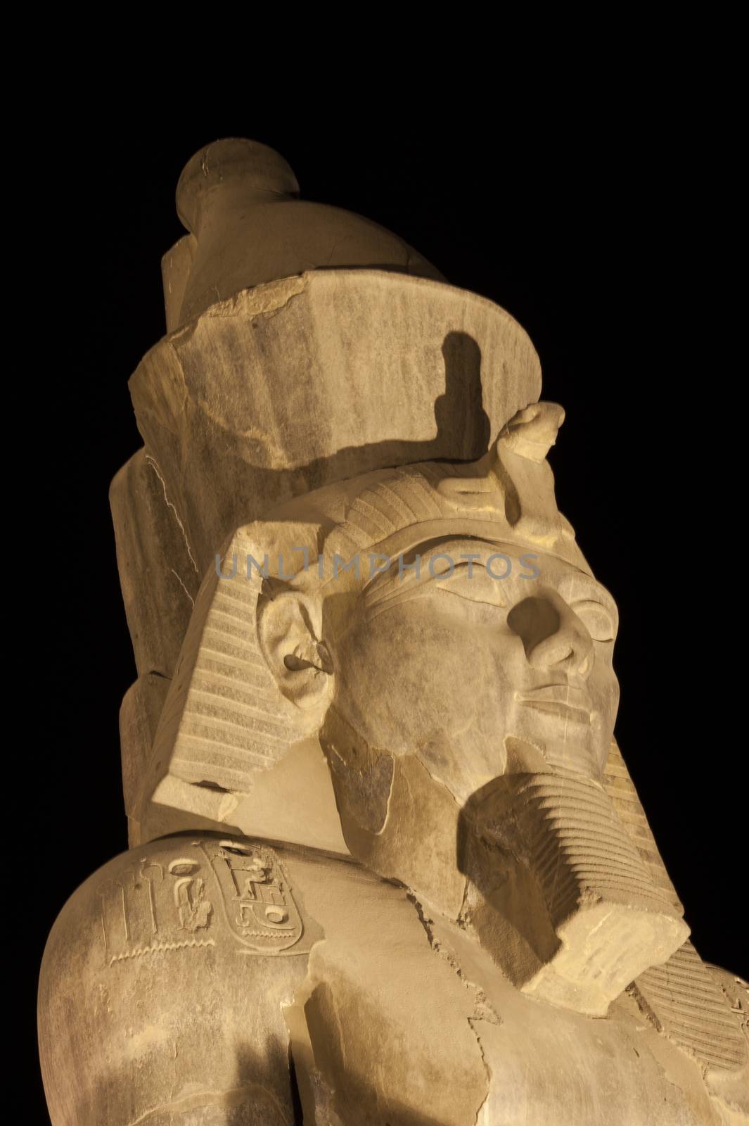 Statue at night in Luxor Temple of Ramses II isolated on black
