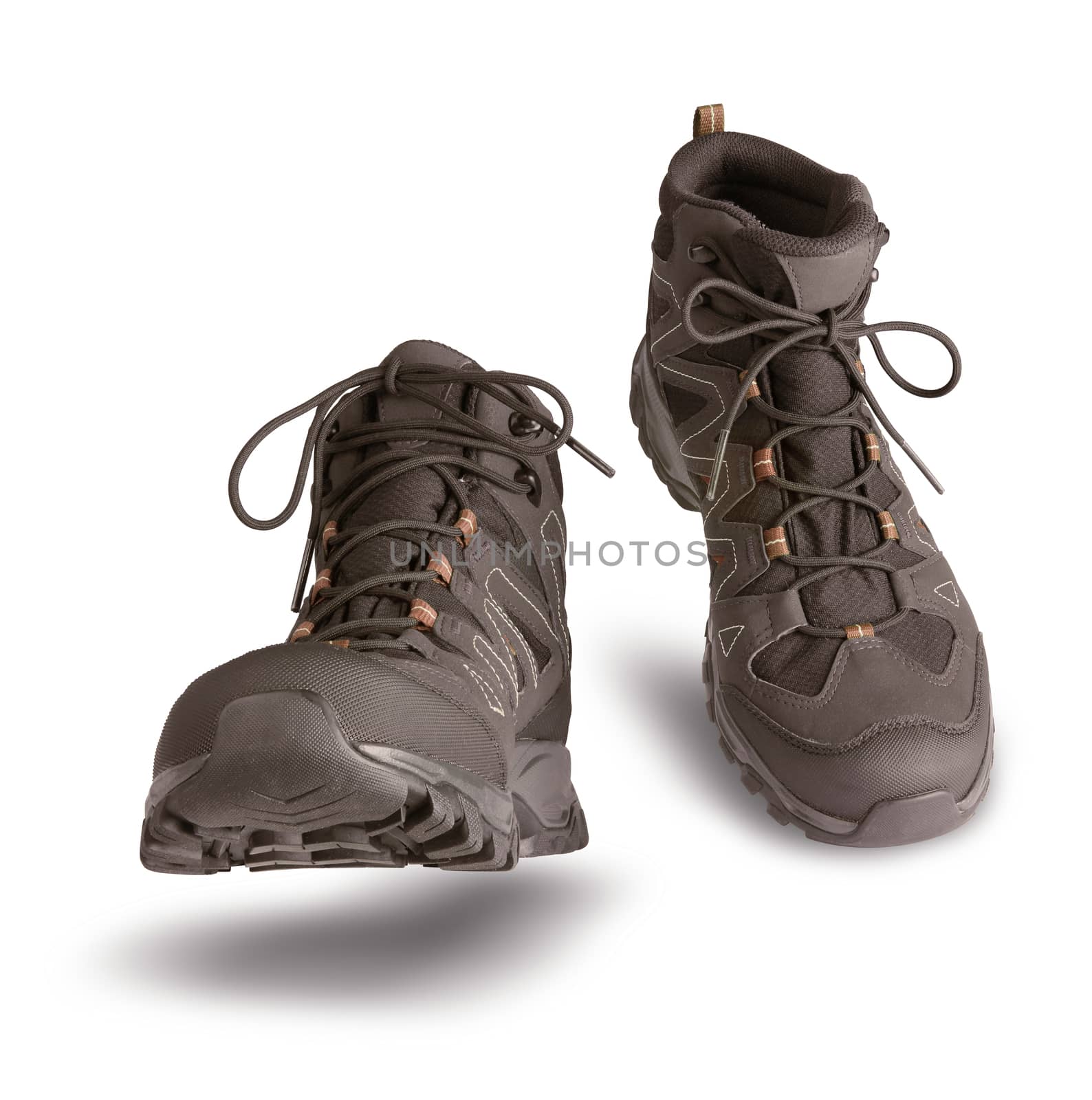 Hiking boots walking on white background, outdoor trekking activity concept