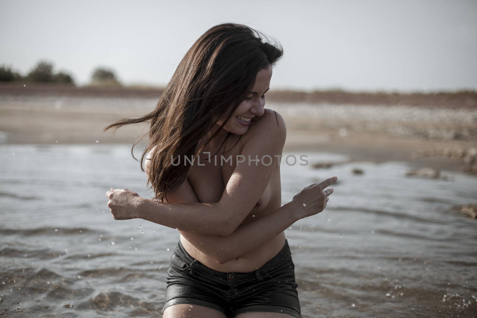 Outdoor lifestyle portrait of beautiful young naked woman on the by snep_photo