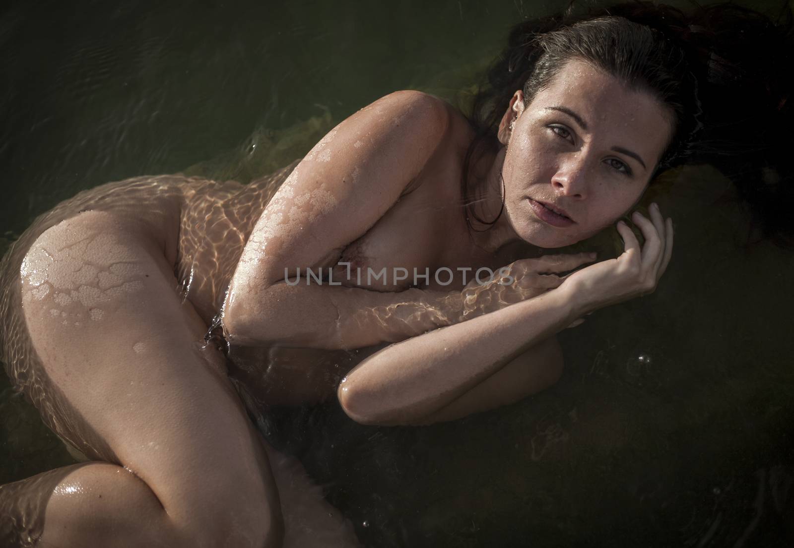 Portrait of beautiful young woman bathing by snep_photo