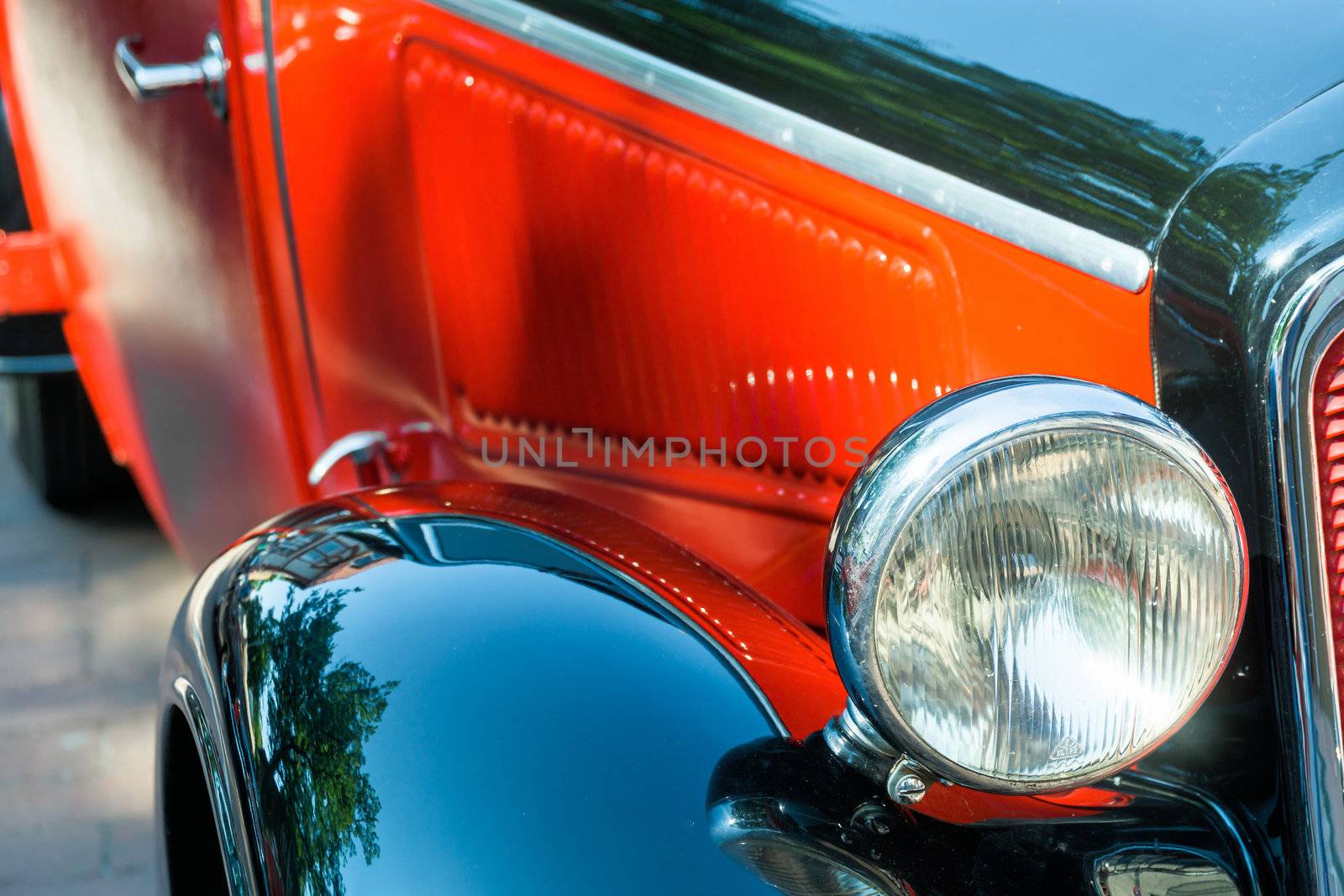 Detailed view of a historic vehicle with free headlights, red bonnet and black shiny wings, Oldtimer-Festival, Germany