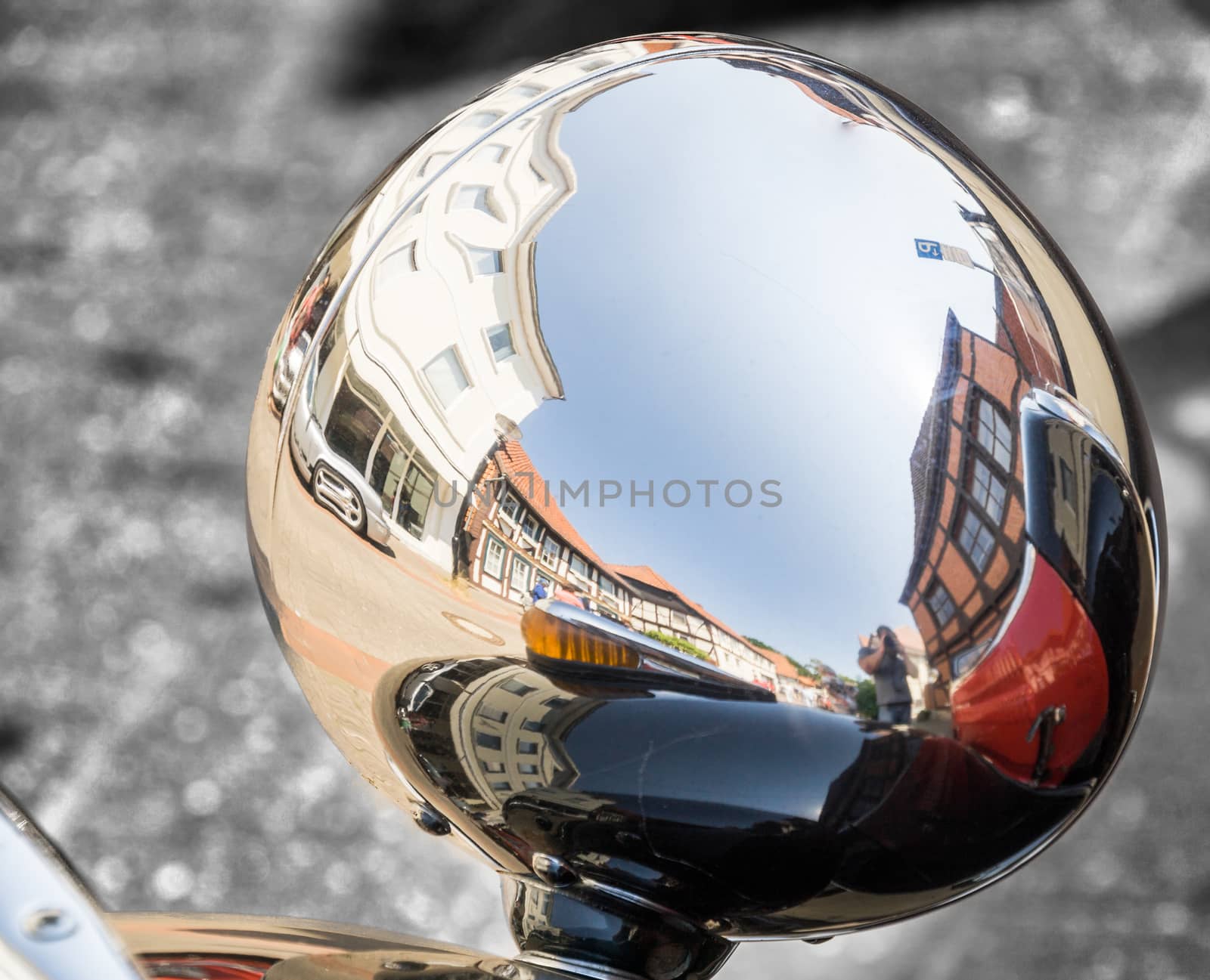 Detailed view from the back of a reflecting headlight on a historic vehicle at a vintage car festival, Germany