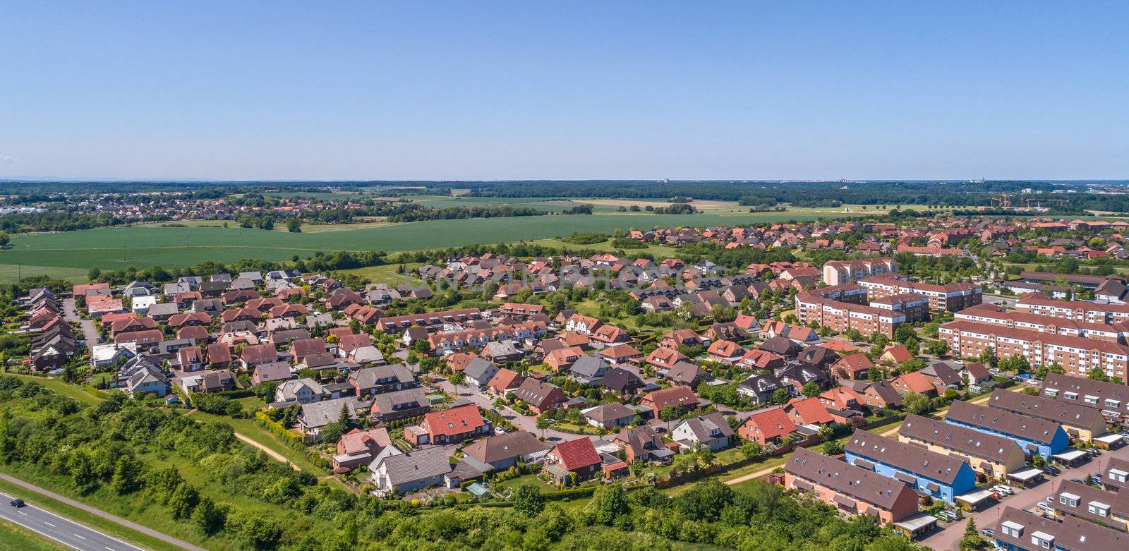 Aerial view of a suburb on the outskirts of Wolfsburg in Germany, with terraced houses, semi-detached houses and detached houses by geogif