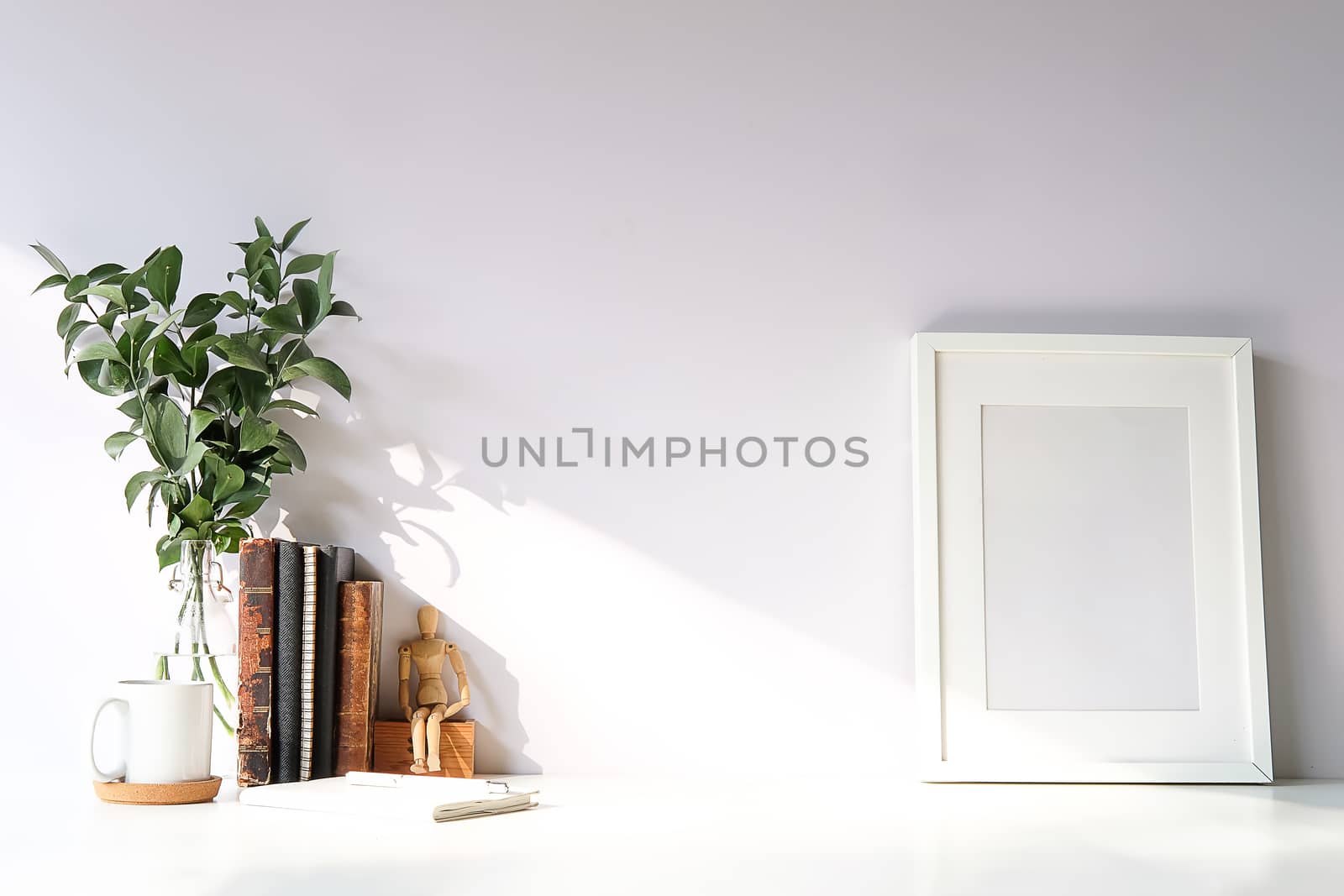 Mockup workspace desk and copy space books,plant and coffee on white desk.
