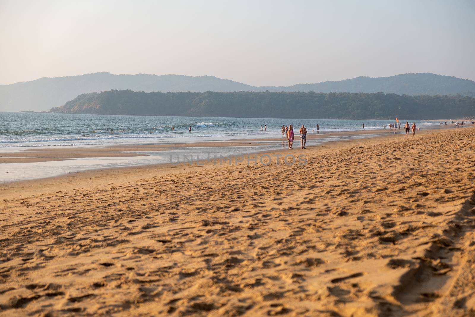 A wide angle view of Agonda Beach in Goa at sunset, India.