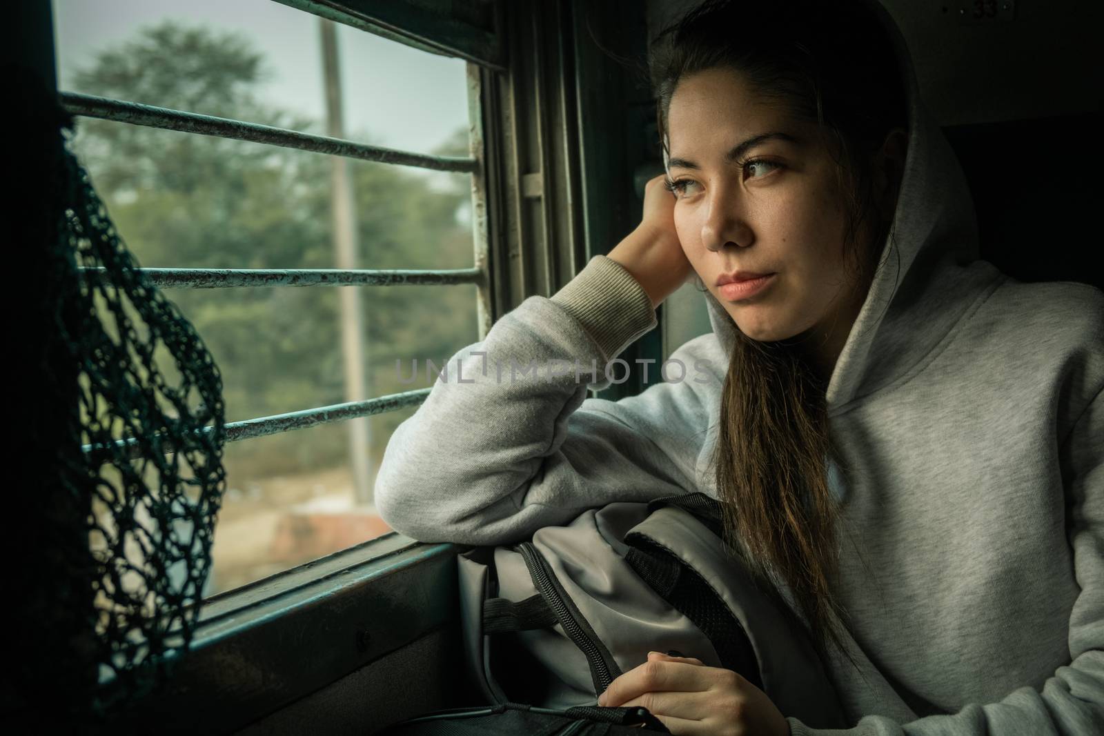 Young female passenger travel by passenger Train by snep_photo
