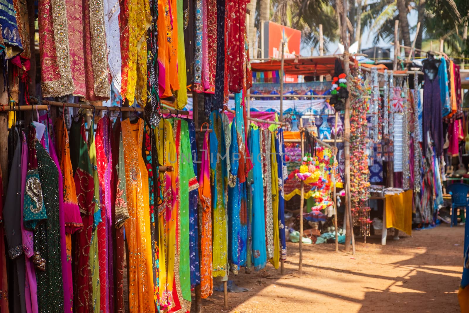 Indian bazaar benches with colorful saris by snep_photo