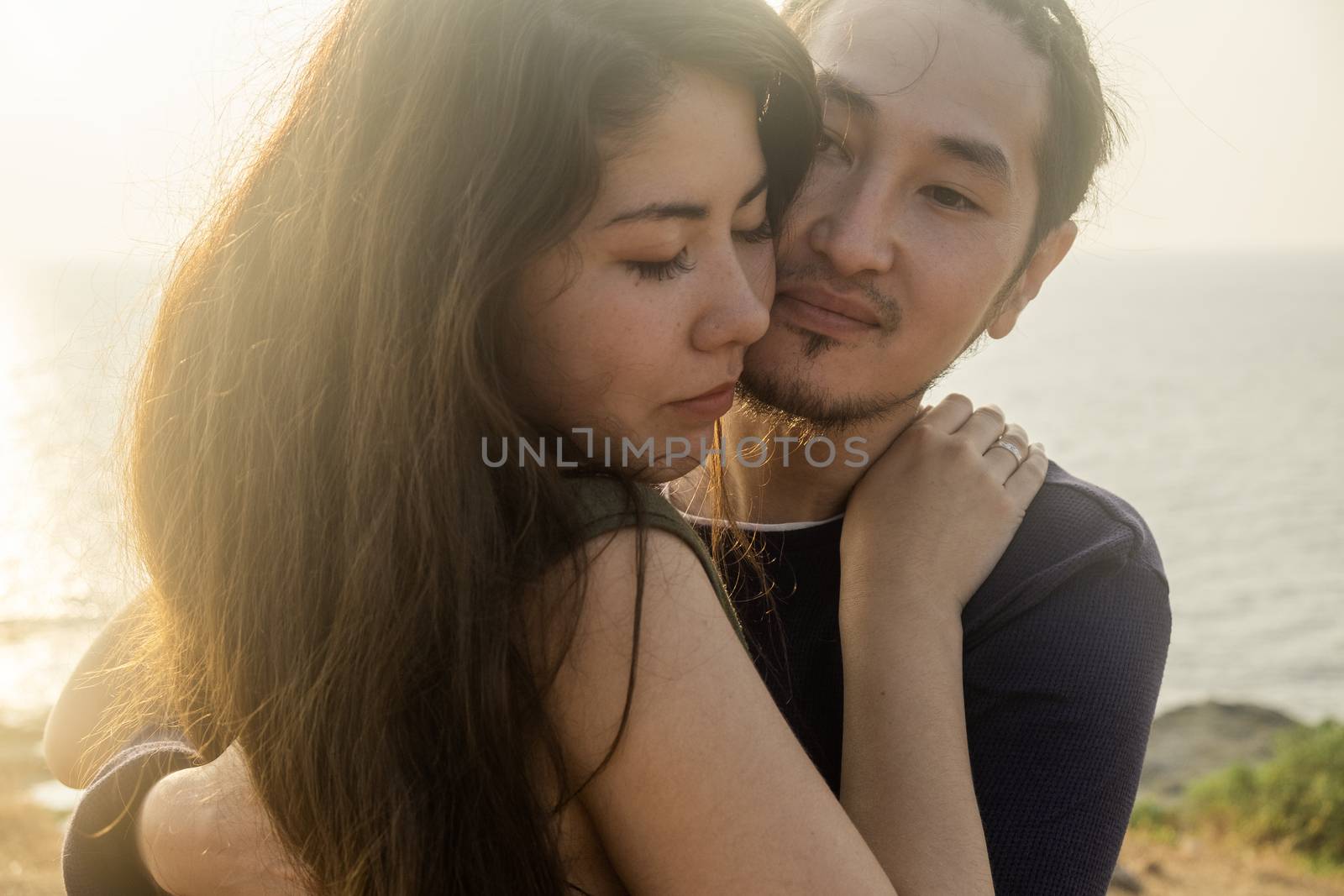 Young Couple Embrace Each Other Lovingly by snep_photo