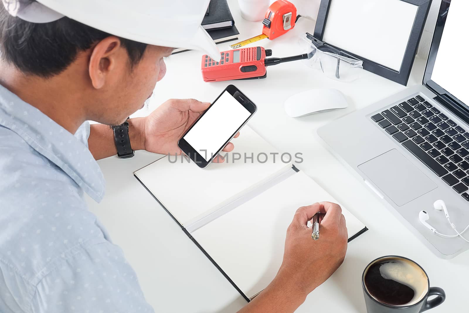 Office desk Workspace stuff with notepad, laptop and coffee cup  by wattanaracha