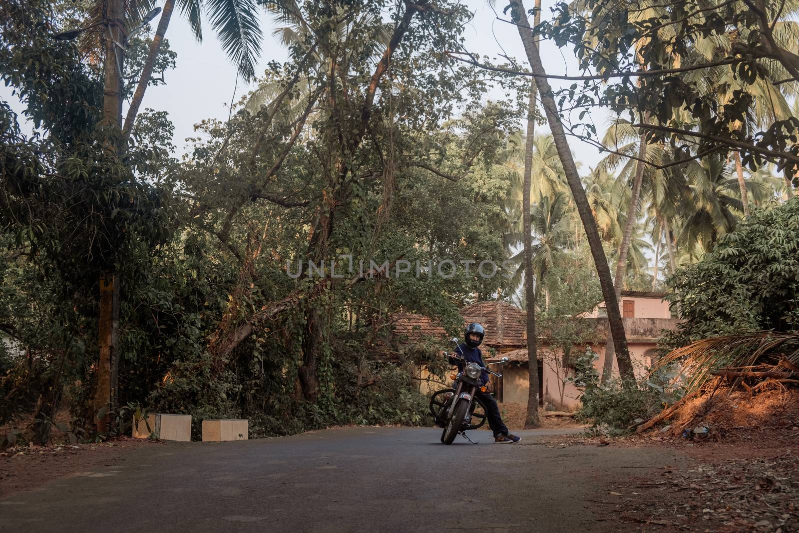 A Man On Motorcycle On Road in GOA village