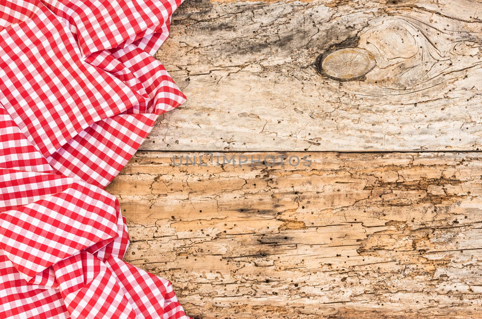 Vintage wooden table background rustic texture, with red checkered tablecloth, high angel view

