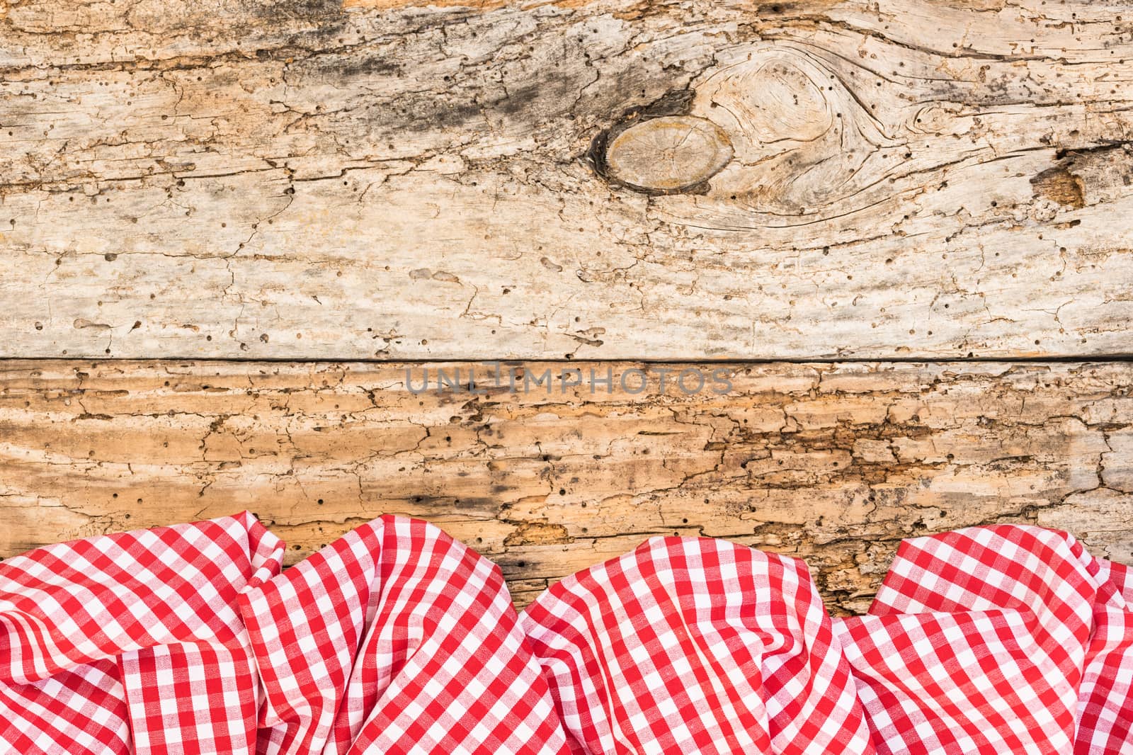 Old wooden table background rustic texture, with red checkered tablecloth, high angel view