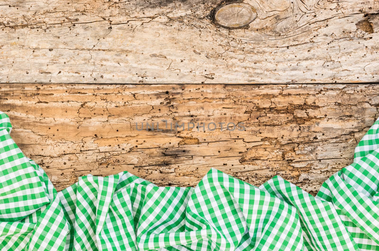 Wooden table background rustic texture, with green checkered tablecloth, high angel view