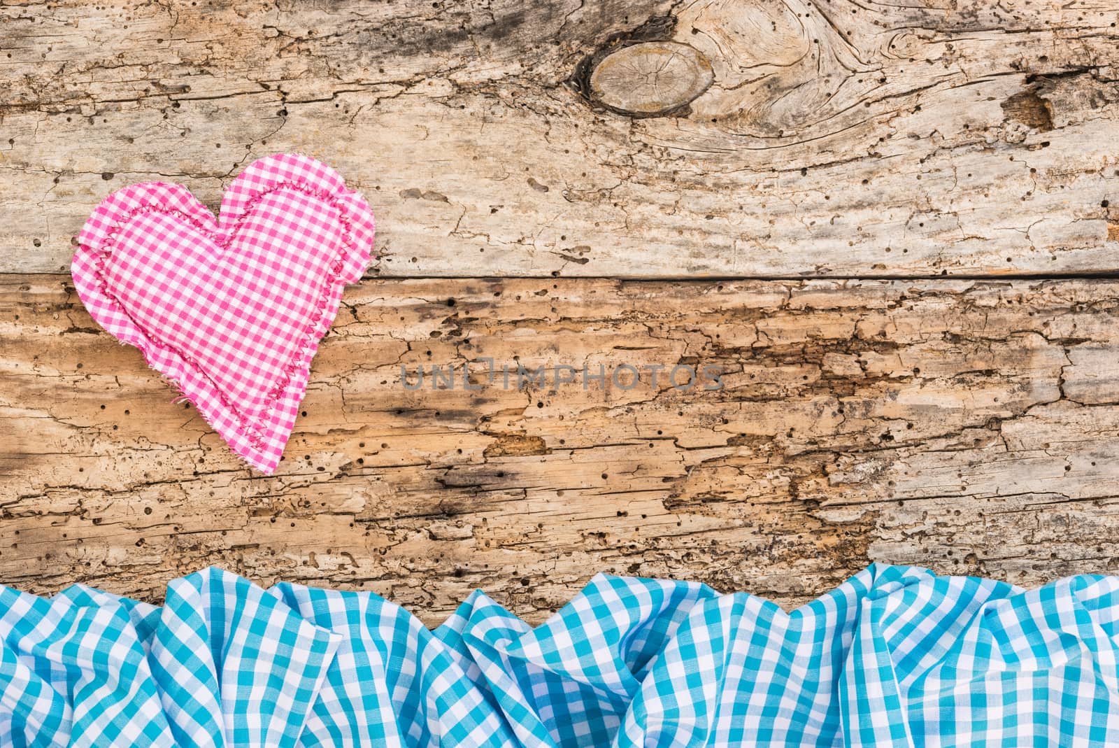 Pink heart on old wooden background with copy space