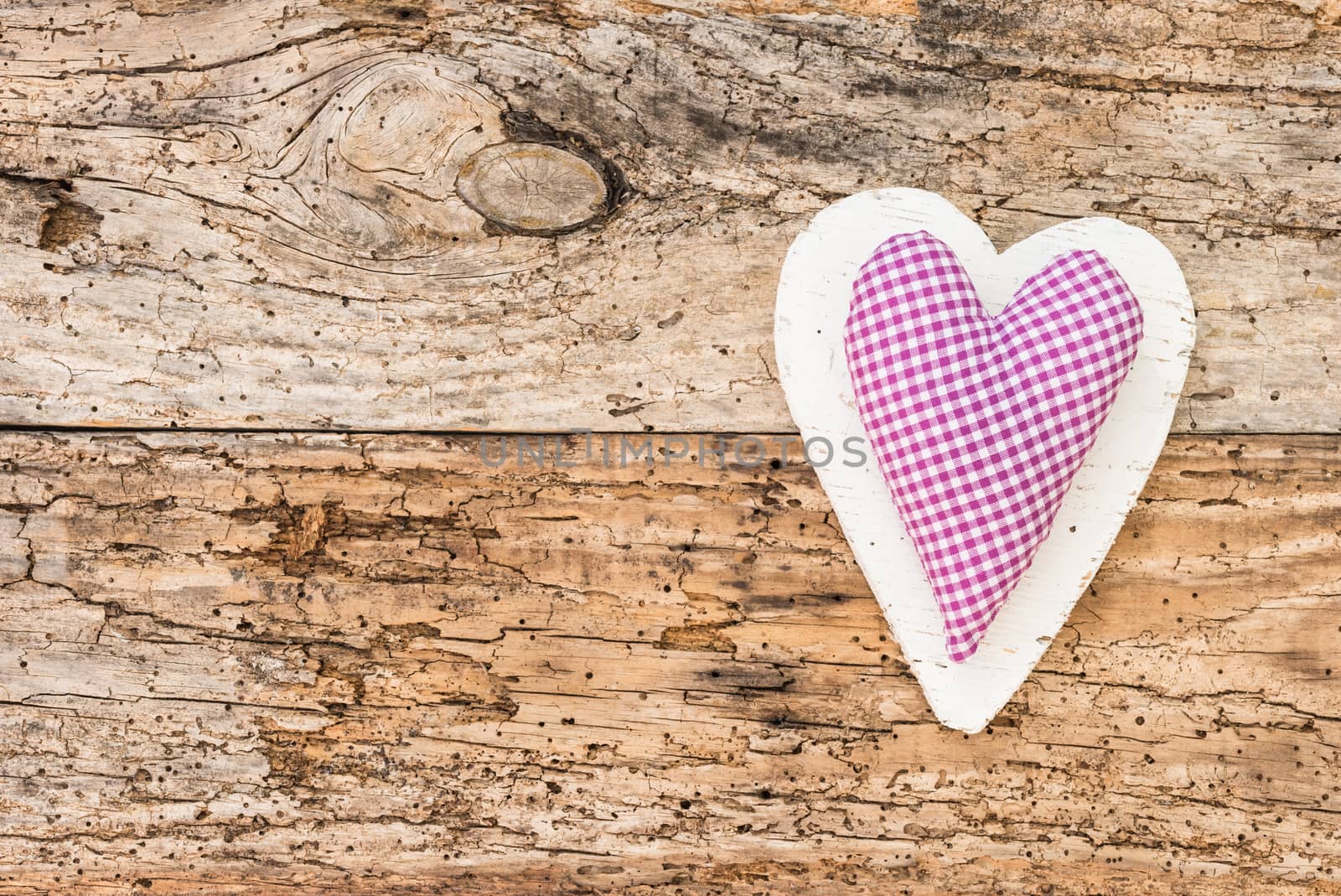 Romantic heart on rustic wooden background with copy space