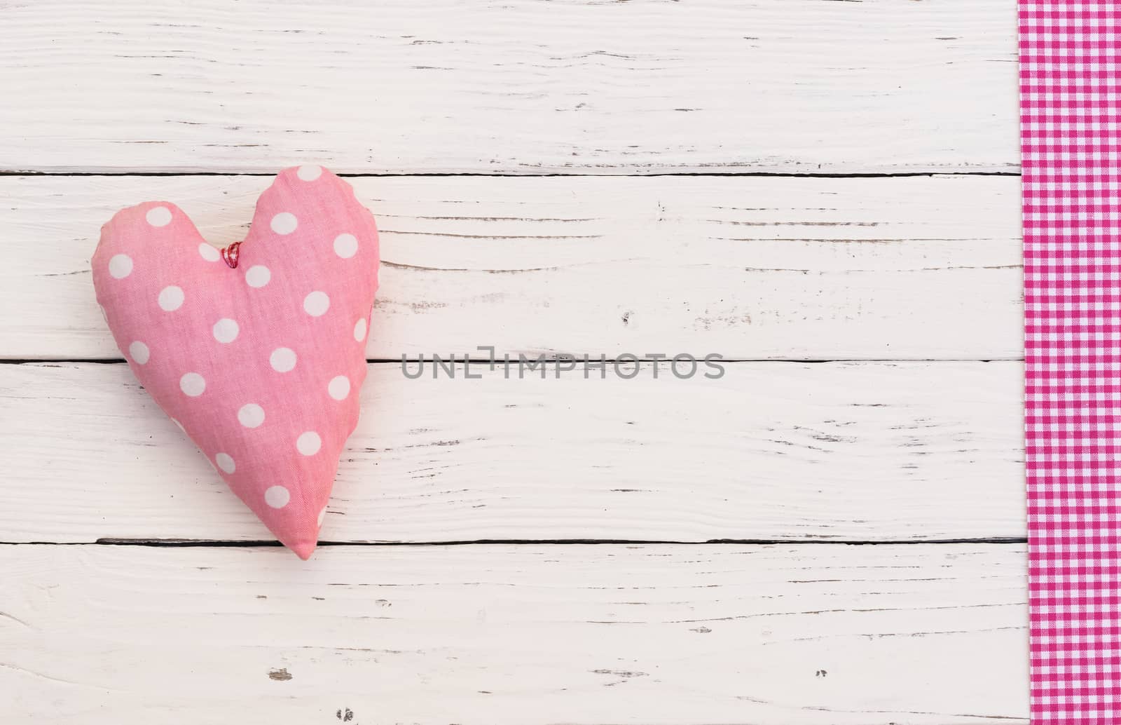 Romantic pink heart on white wood background for Valentine card with copy space