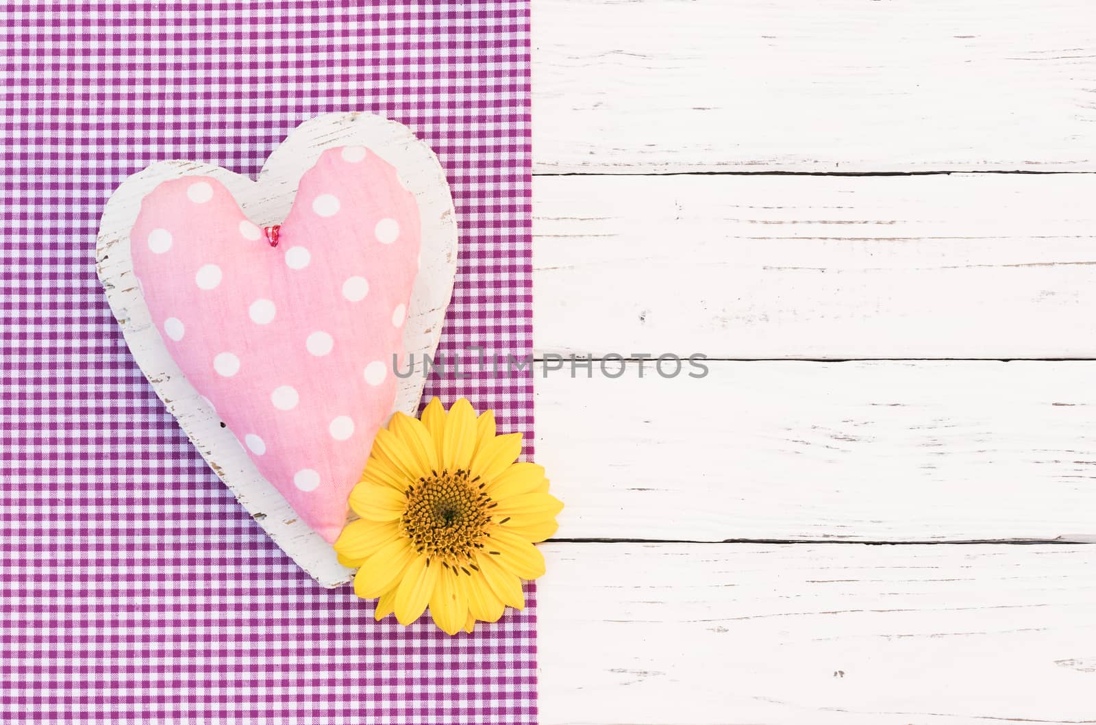 Romantic pink heart with blossom on white wooden background with copy space