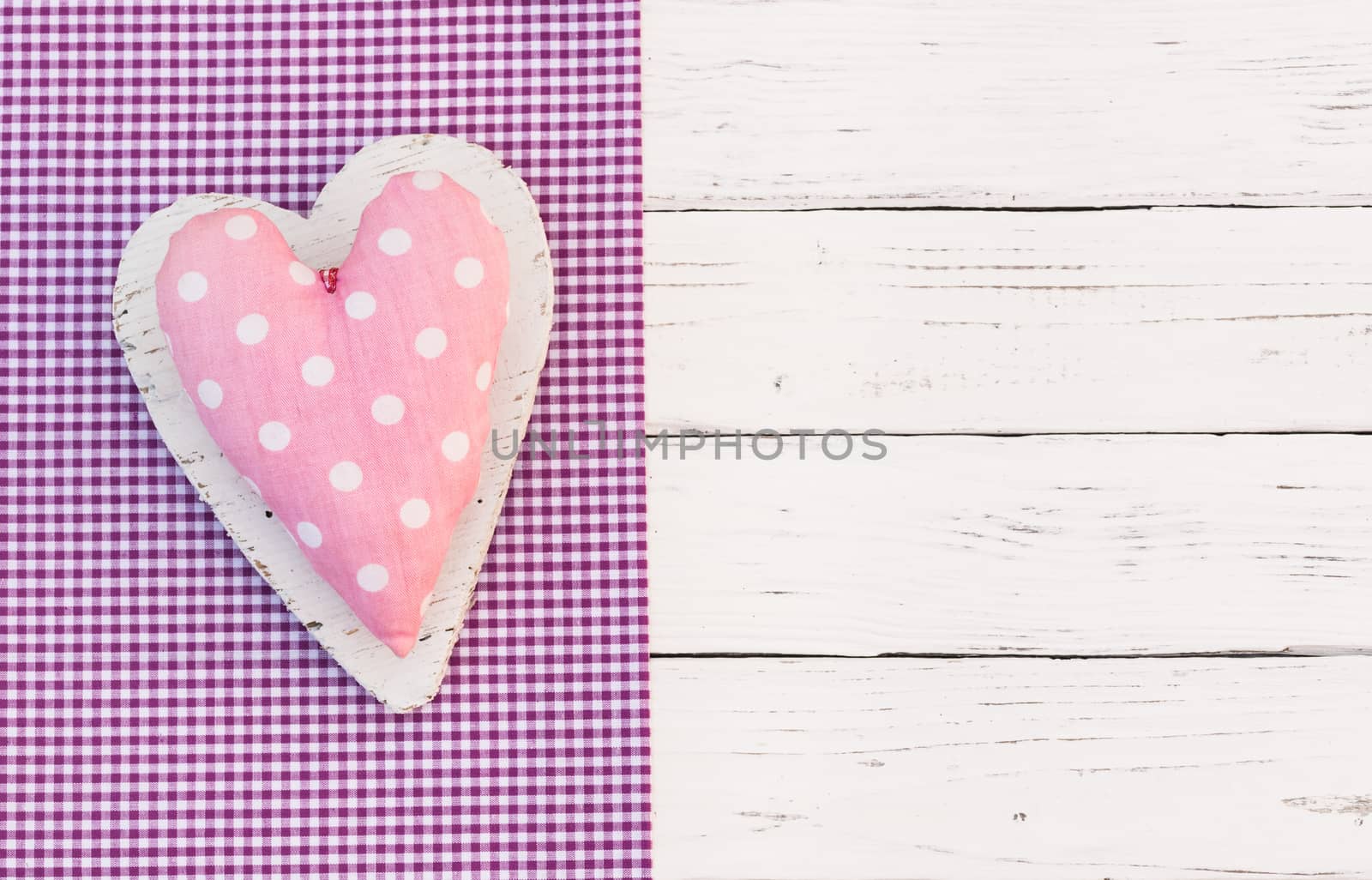 Romantic pink heart on white wood background for Valentine card with copy space