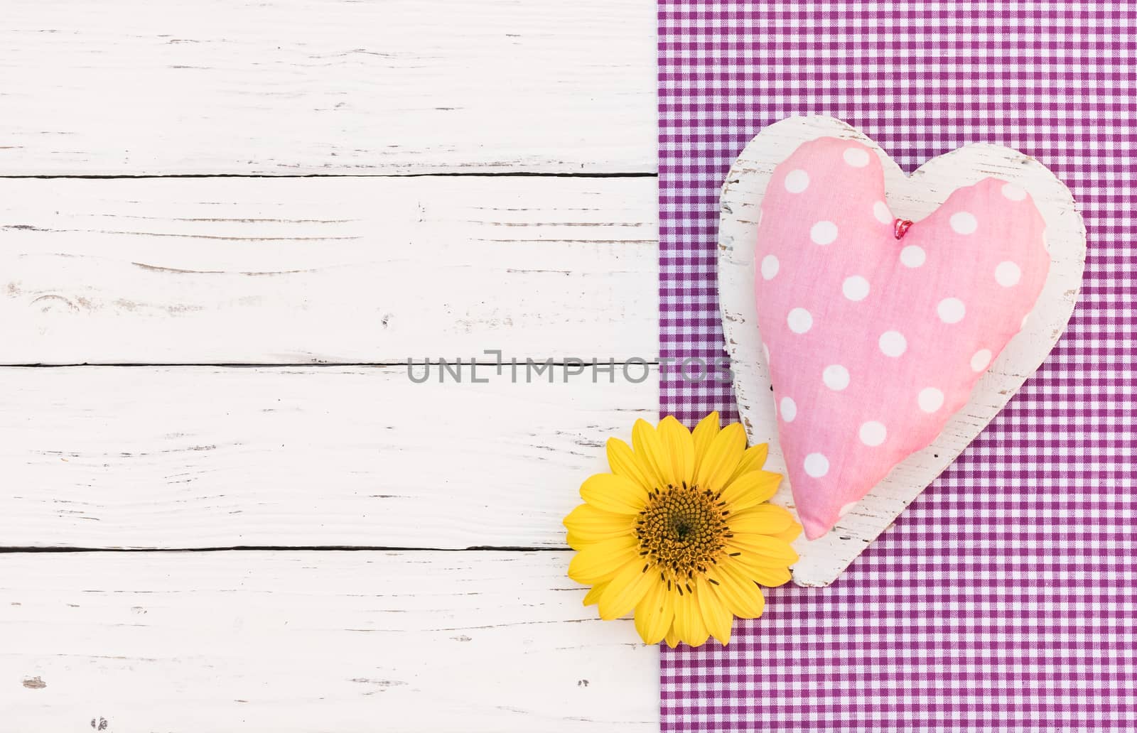 Baby girl birthday greeting card background with pink heart and yellow flower